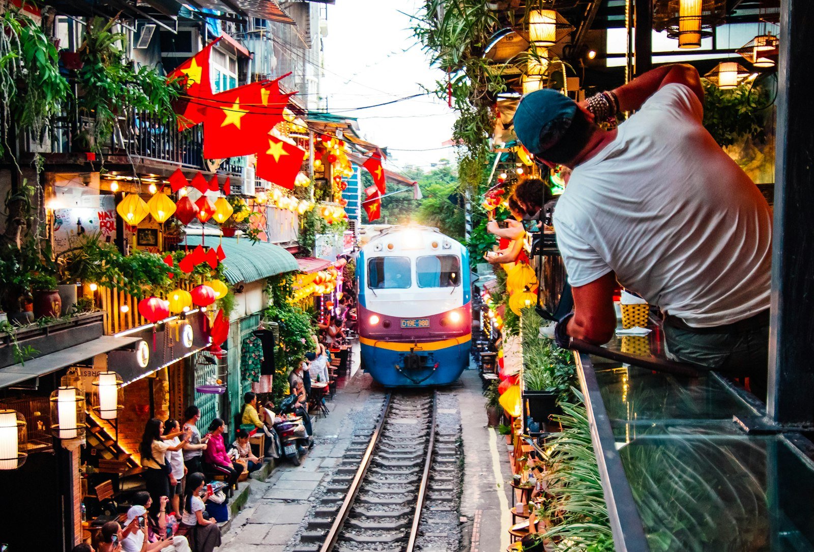 A train passing through a narrow street in Hanoi
