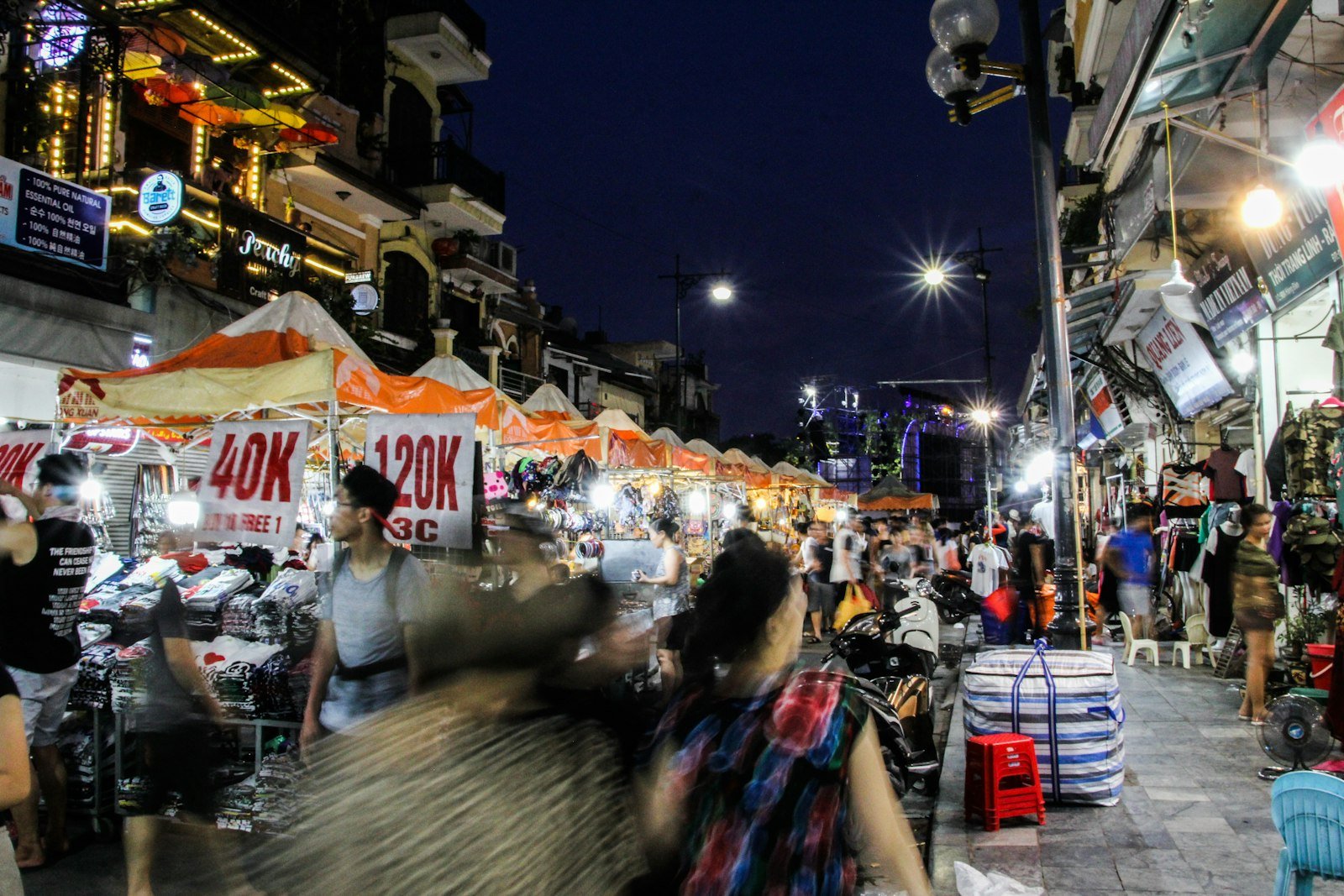 People shopping at a busy night market