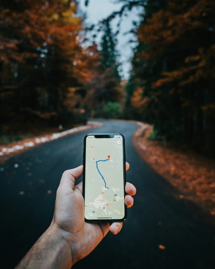 A traveler holding a smartphone with a map