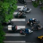 Motorbikes riding down a busy street in Vietnam