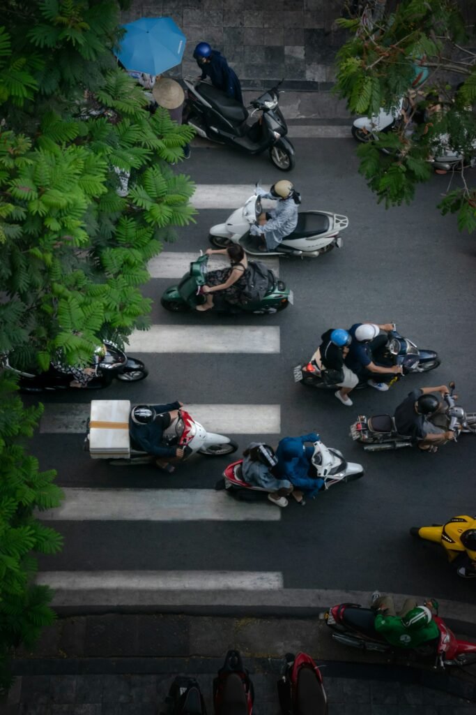 Motorbikes riding down a busy street in Vietnam