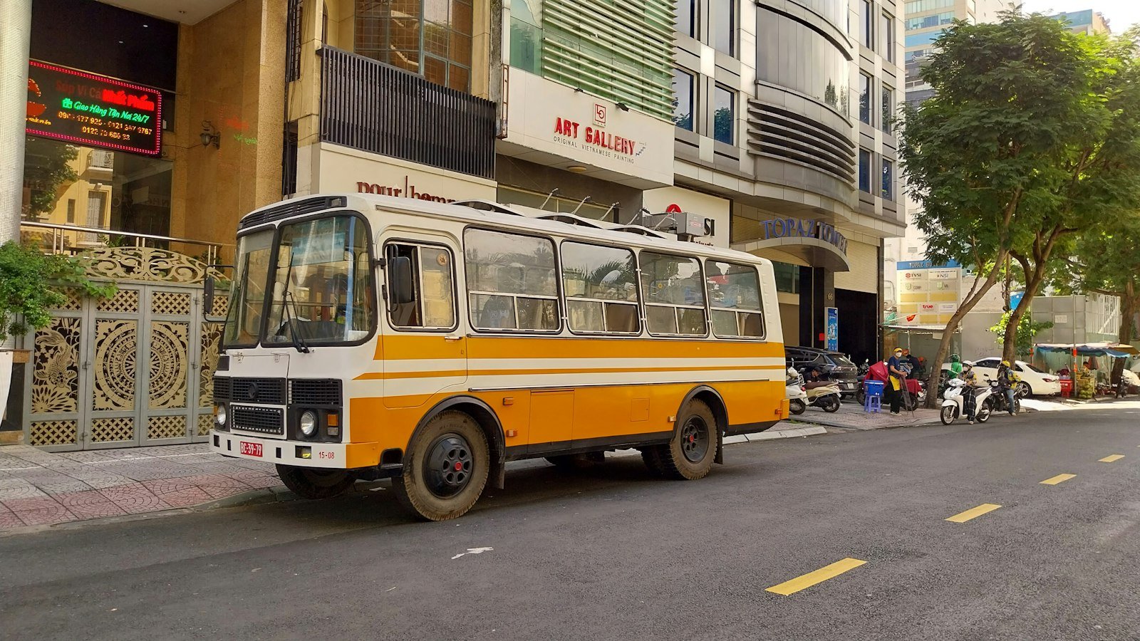 An intercity bus parked at the side of a road