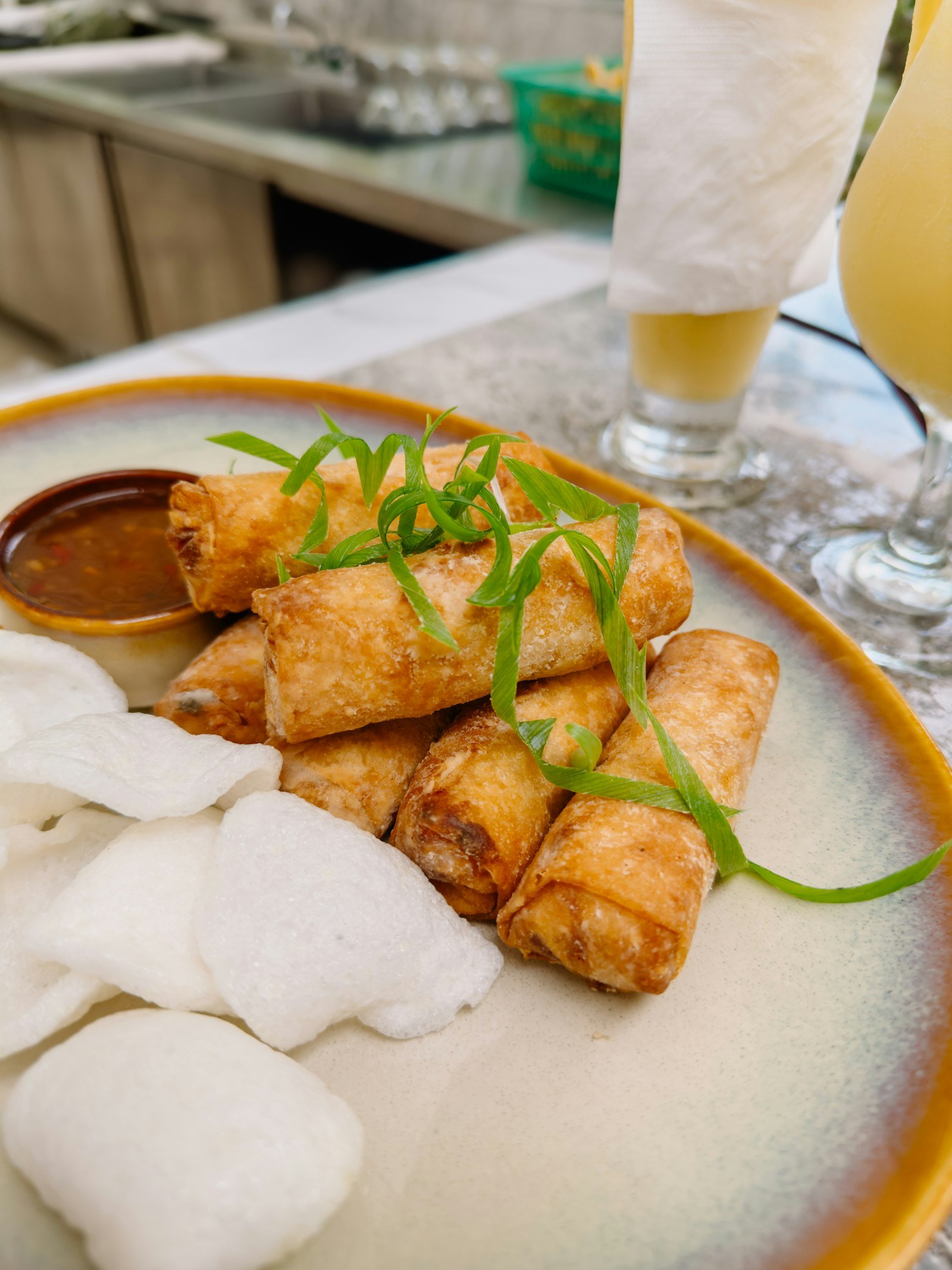 A plate of Vietnamese rolls on a table